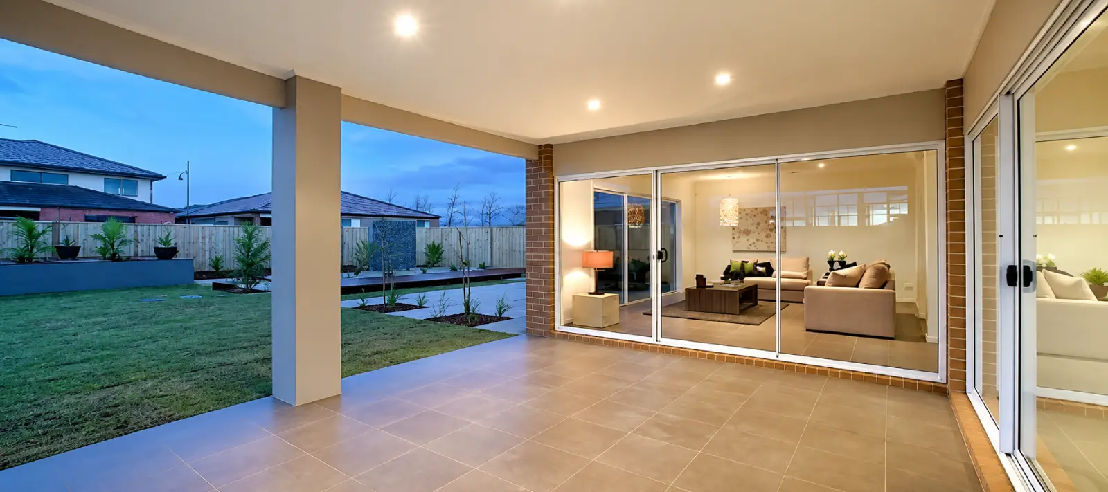 Luxury tiled patio renovation overlooking the city at dusk