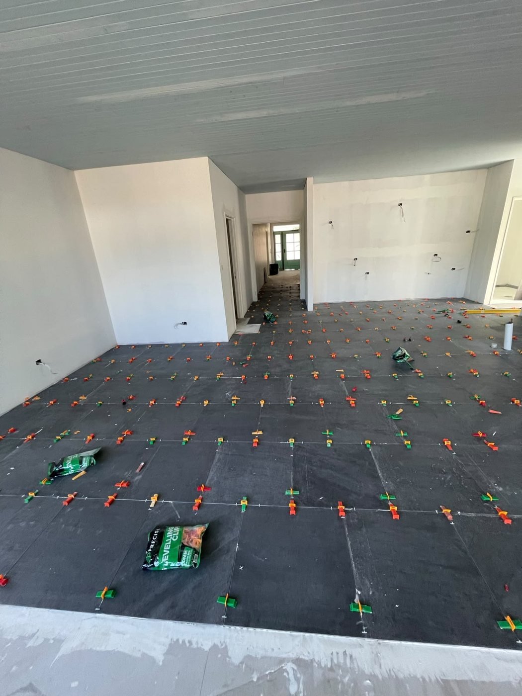 Large Format Floor Tiling — open-plan living floor set out and laid to level, Ellenbrook, WA